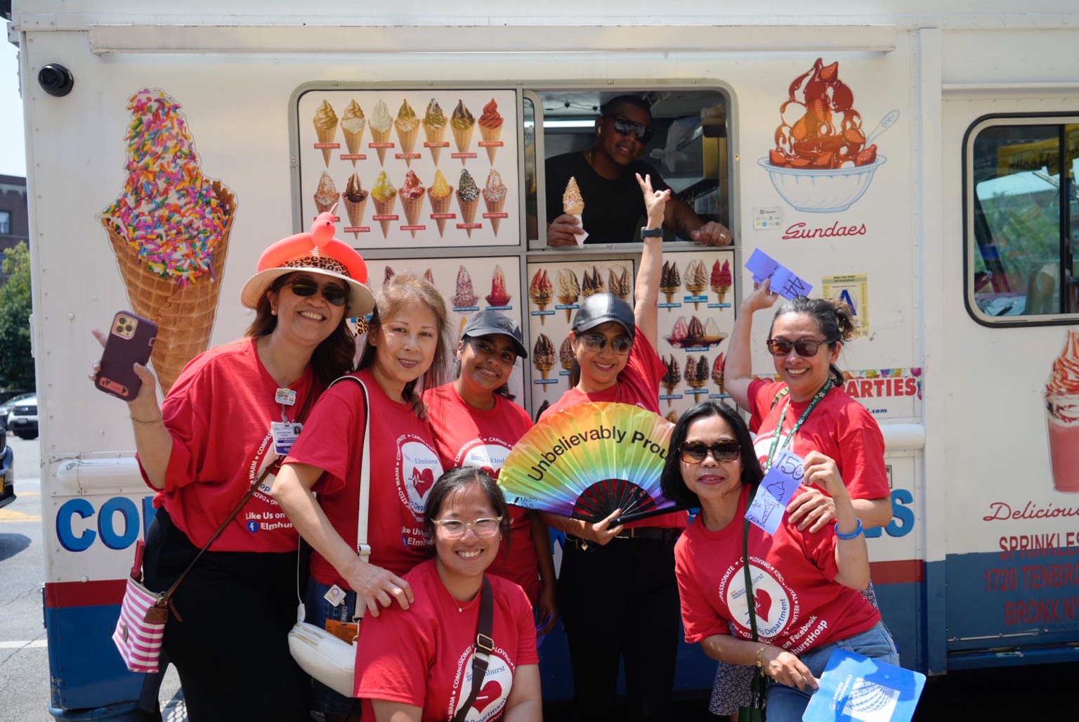 A group of event attendees smiling in front of our ice cream truck